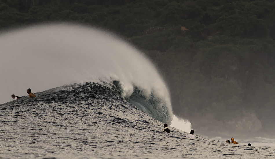 This is a shot taken from an un-seaworthy water taxi. When the swell is pumping on the East coast of Bali, you better bring your A game and an extra pair of cojones. Pete Cox, digging in on Bali\'s east coast.
